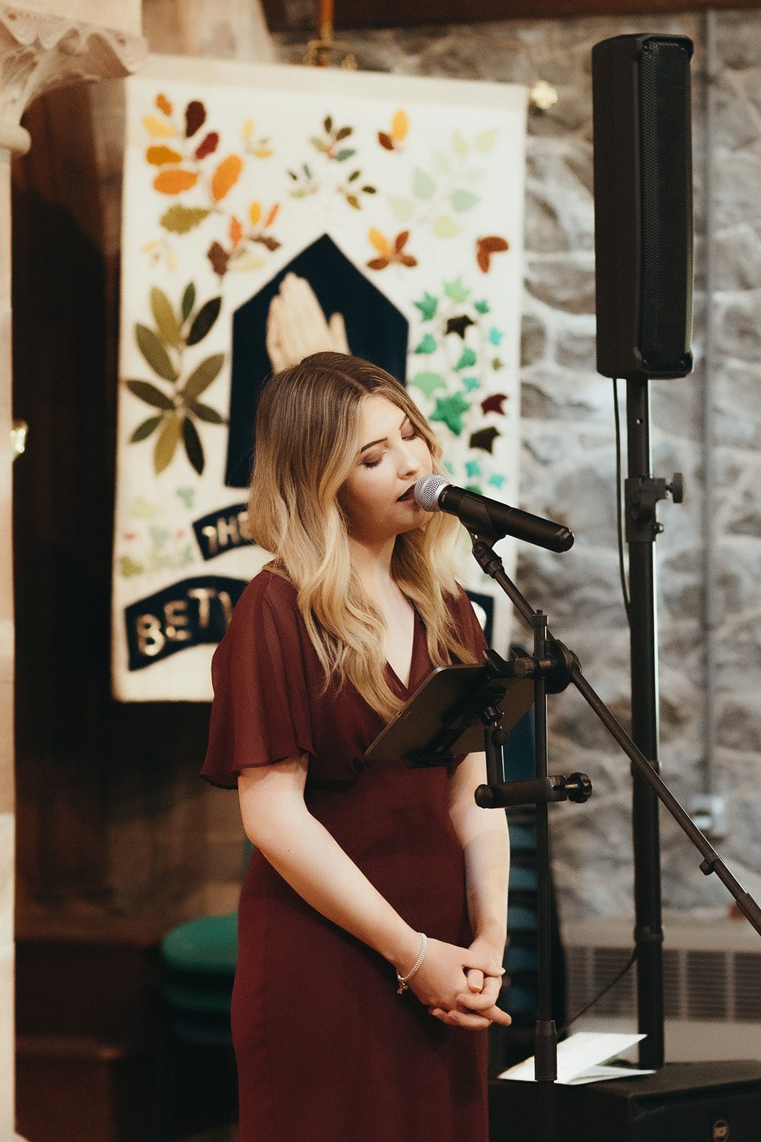 Jenny Jones singing at a wedding ceremony in church